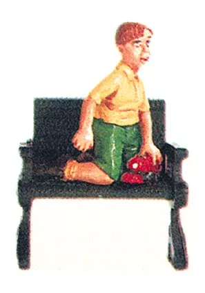 Seated Boy with Toy Locomotive by Aristo Craft